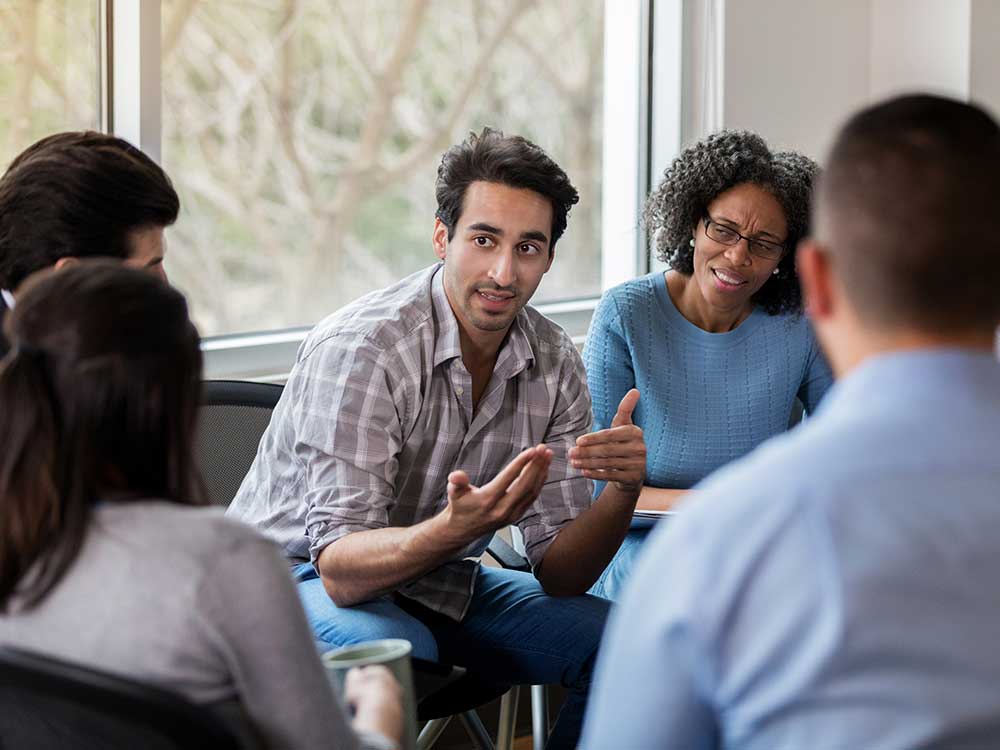 Group of people talking to each other
