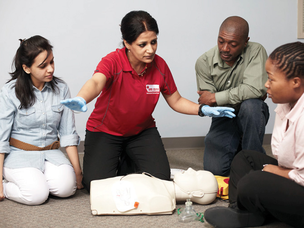 First aid trainer with students