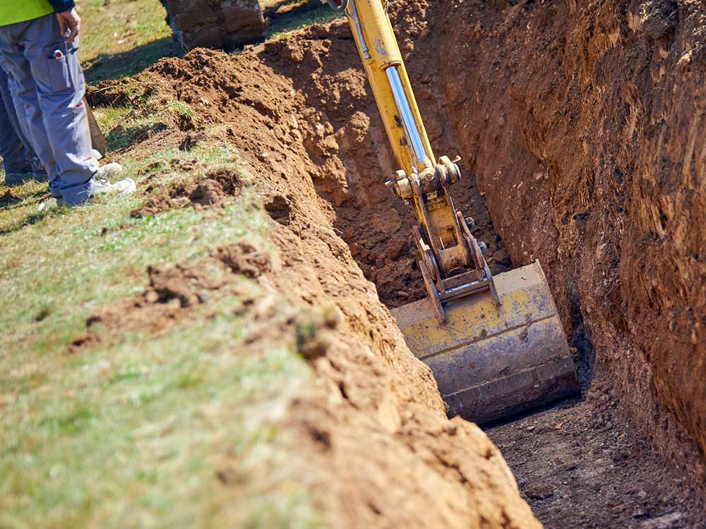 Digging a trench with an excavator